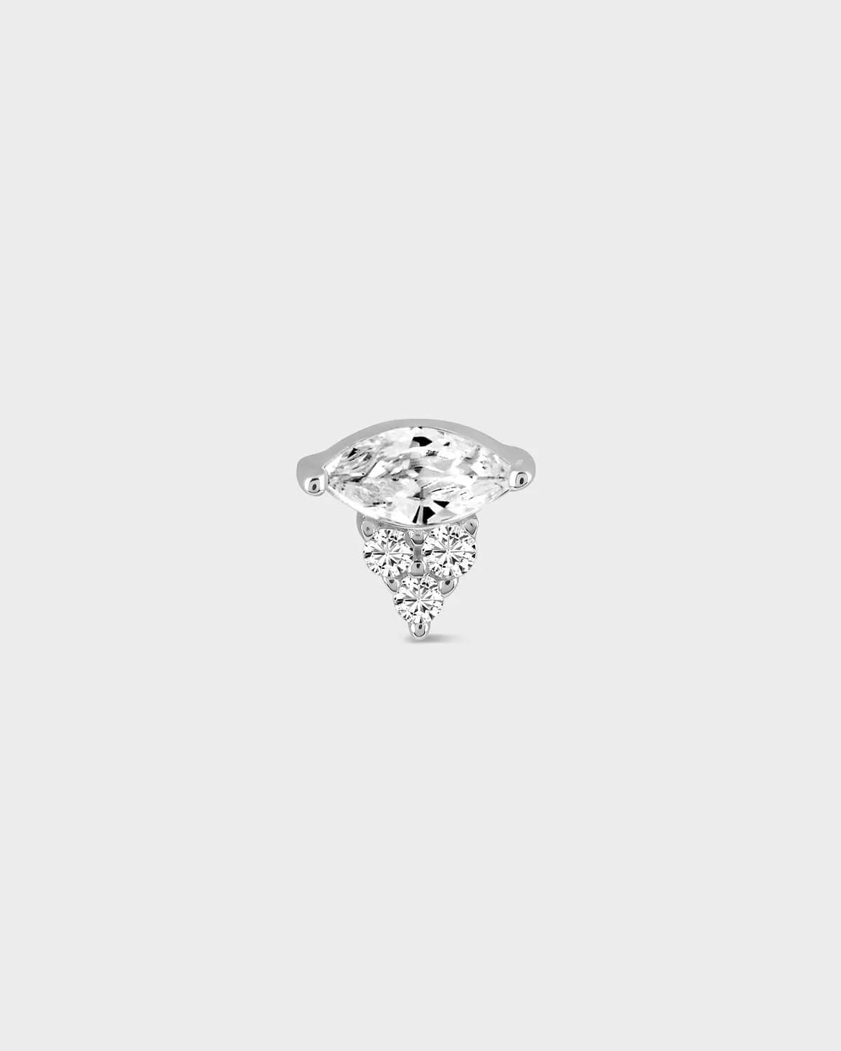 Diamond stud earring on a light gray background