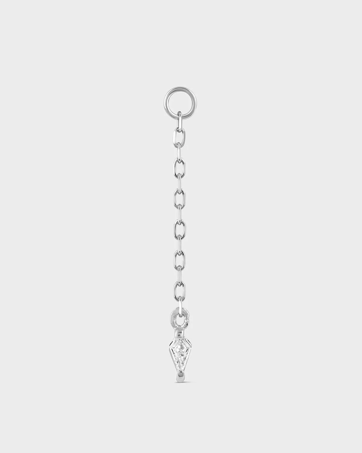 Silver chain with a key-shaped pendant on a light gray background