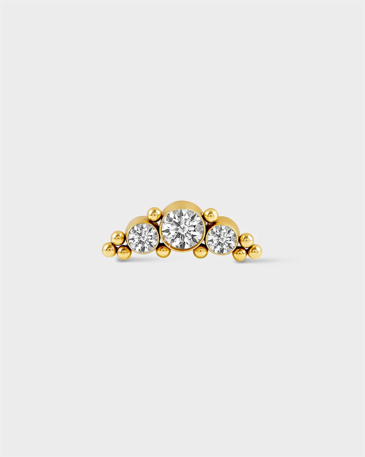Earring with 3 gems in a crescent shape with small bead detailing in 24k Gold PVD on a light grey background