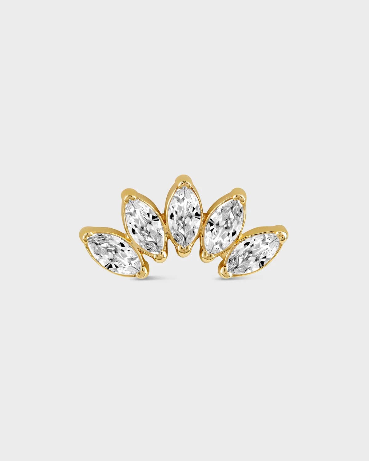 Gold earring with five marquise gems on a light gray background
