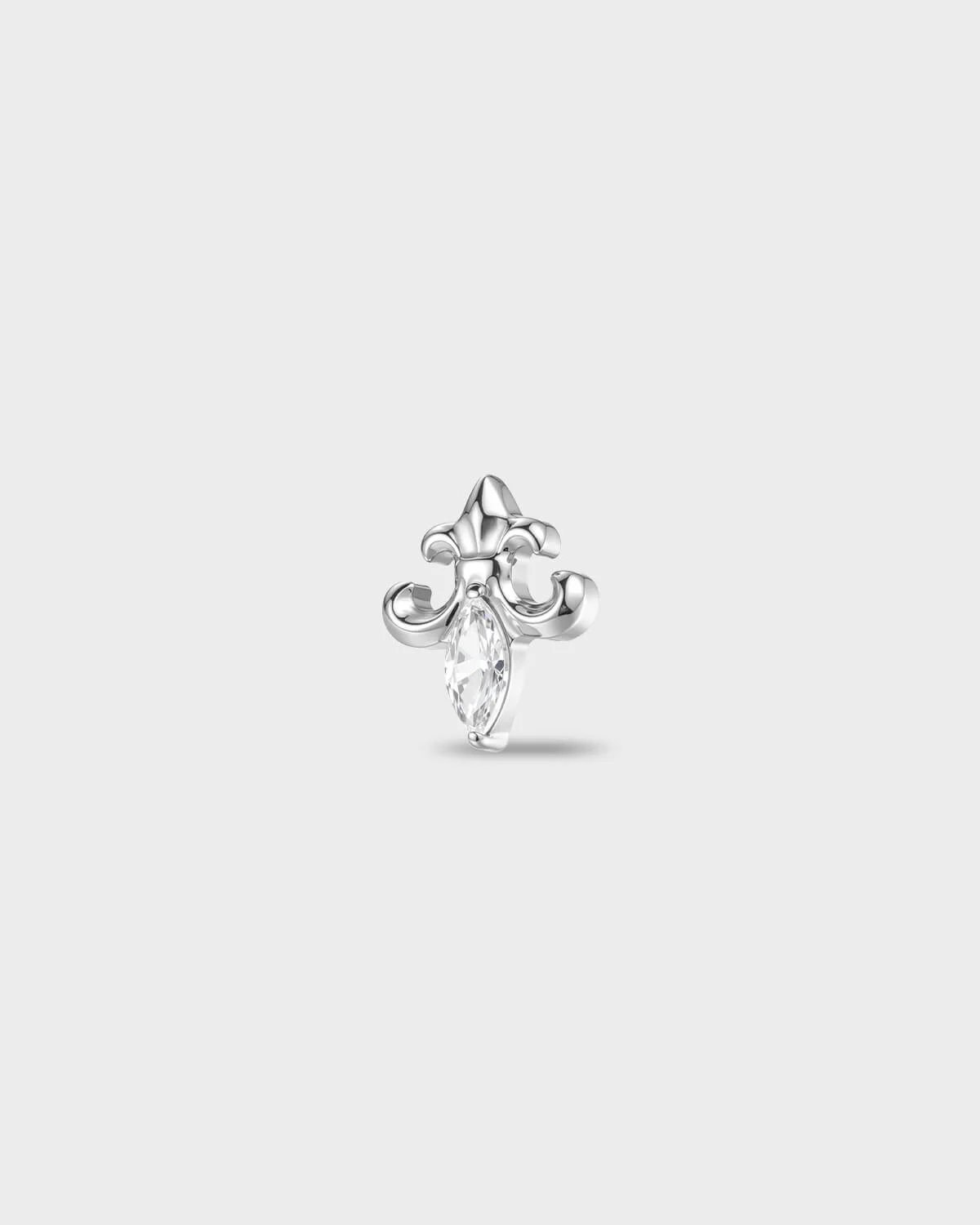 Polished titanium earring with a sculpted fleur-style shape and a marquise-cut clear stone set at the centre, on a light gray background.