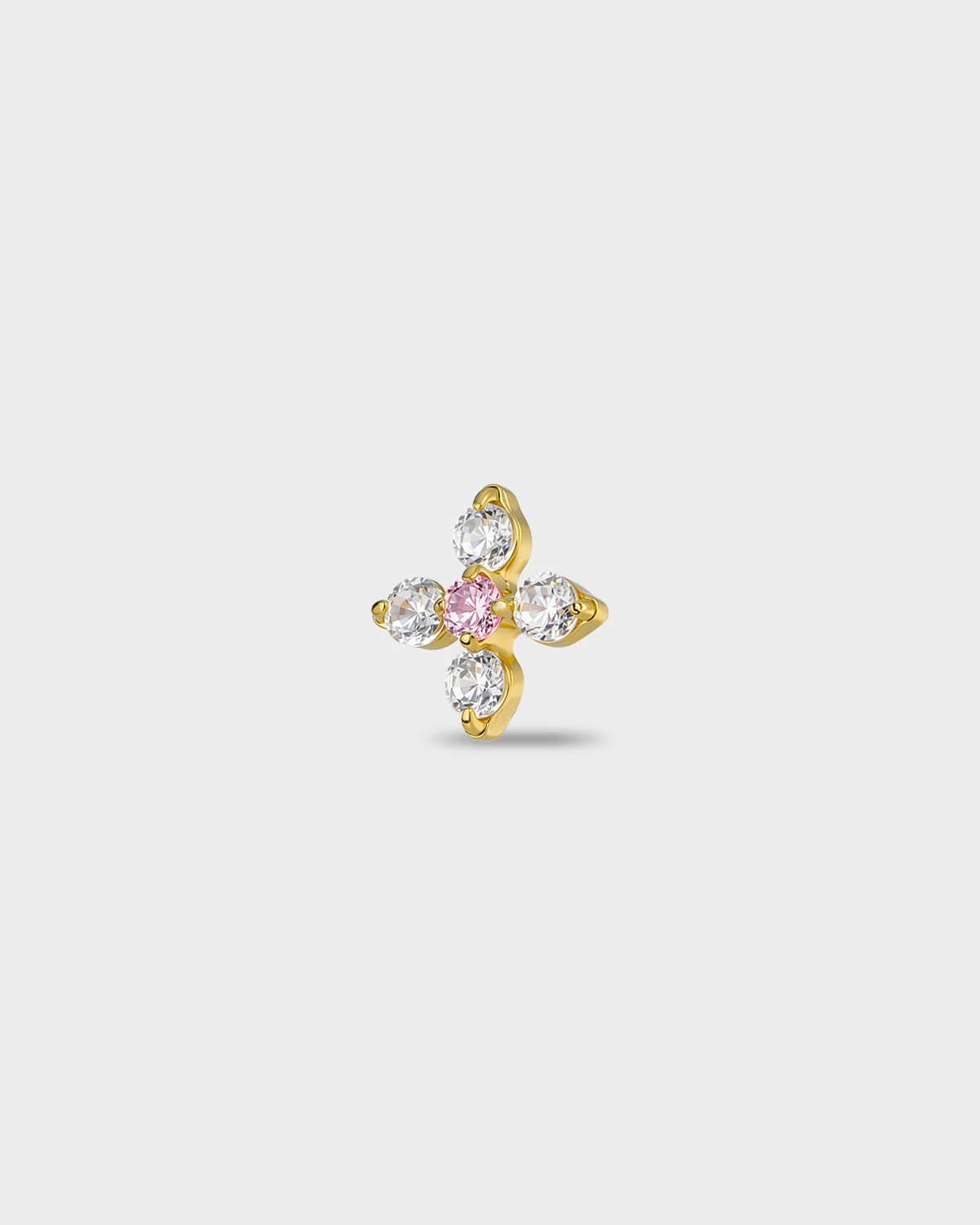 Gold titanium earring with four round-cut clear stones set around a single round-cut pale pink stone, on a light gray background.